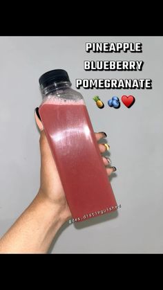 a hand holding a bottle of blueberry pomegranate next to the words pineapple blueberry pomegranate