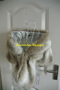 a coat hanging on a door with the name amanda design