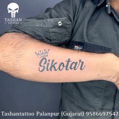 a man with a tattoo on his arm that says skotar in black ink