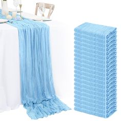 the table is set with blue and white linens