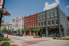 a row of buildings on the corner of a street