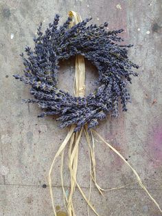 dried lavender wreath with roots on concrete surface