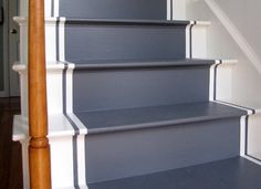 the stairs are painted blue with white trim