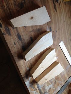 several pieces of wood sitting on top of a wooden table