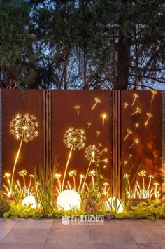 a metal fence with lights and dandelions on it