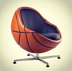 an orange and black basketball sitting on top of a chair