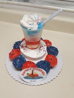 an ice cream sundae with red, white and blue sprinkles on it