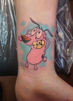 a cartoon character tattoo on the ankle