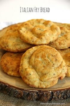 some biscuits are sitting on a plate with the words italian fry bread in front of them