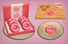 a pink box with donuts in it next to a plate and bowl