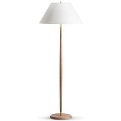 a wooden floor lamp with a white shade on the base and a light bulb at the top