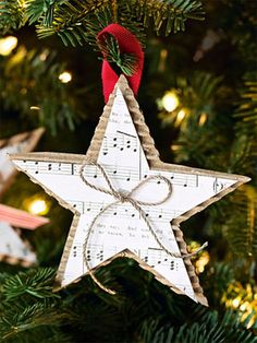 an ornament hanging from a christmas tree decorated with music notes and a star