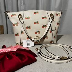 Hard To Find Purse And No Longer Sold By Coach. Coach Kacey Satchel With Strawberry Print. Purse Only Worn Three Times. In Like New Condition With No Seen Stains On The Exterior. Few Minor Scuffs In The Interior As Pictured. Refined Pebble Leather Inside Zip Pocket Zip-Top Closure, Fabric Lining Handles With 5" Drop Outside Zip Pocket Detachable Strap With 22" Drop For Shoulder Or Crossbody Wear 10" (L) 81/2" (H) 3 3/4" (W) Style No. Cb597 Coach Strawberry Bag, Coach Strawberry, Strawberry Bag, Bags Coach, Strawberry Print, Zip Top, Pebbled Leather, Coach Bags, Zip Pockets