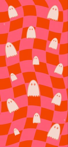 an orange and pink pattern with white ghost heads on it's sides, in the middle