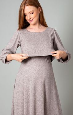 Be the classiest mama in town with our Vivian maternity and nursing dress. Created in a sumptuous ribbed knit jersey with a hint of sparkle, this midi-length nursing style has all the flare you need for effortless glamour in every way. Featuring concealed side pockets in the skirt and relaxed wrist-length sleeves. Simply lift the front panel for discreet access to nursing pockets. This dress is for keeps whatever the event. Light chocolate brown ribbed knit maternity and nursing midi dress Soft Feeding Friendly Outfits, Classy Maternity Style, Vintage Maternity Dress, Diy Nursing Dress, Modest Maternity Outfits, Nursing Dress For Wedding, Formal Nursing Dress, Modest Maternity Dresses, Nursing Dress Breastfeeding