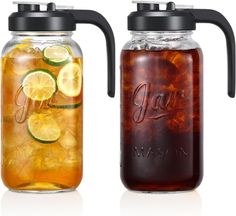 two mason jars filled with liquid and lemon slices