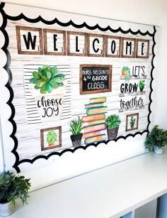 a welcome sign with books and plants on it