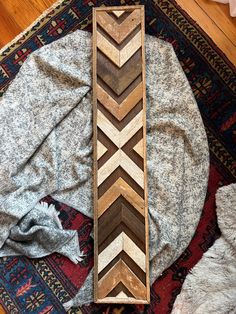 a piece of wood sitting on top of a rug