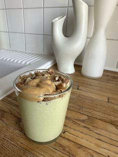 a dessert in a glass on a wooden table