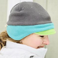 "OMG!!!! Never knew a hat that would fit perfect, is very comfortable, soft, and keeps my ear warm too...all in one, wow!" - Gail, TX Women's Fleece Beanie Hat A Trio of Colors Hat! This anti-pill fleece newsboy hat is designed with function, style and you in mind. Need more color in your life? Yes! Triple your fun in the new fleece hat color combo in a pre-selected trio of yummy fleece colors! Whether you're shoveling the driveway or tackling the big grocery day on a blustery winter day - do it Windproof Beanie Hat One Size, Warm Bonnet For Outdoor Use, Warm Brimmed Beanie For Outdoor, Adjustable Beanie With Ear Flaps For Outdoor, Winter Outdoor Cap, Winter Hats For Outdoor Activities, Winter Bonnet With Ear Flaps, One Size Fits Most, Casual Beanie With Ear Flaps For Outdoor, Cozy Adjustable Hats With Ear Flaps