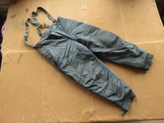 Great vintage 1950s / 60s US Air Force heavy insulated winter flight pants with suspenders. In very good condition, some light wear and marks. Marked size 36, fits Men's Large. Measurements, in inches with garment laid flat: 19.5 waist, side to side 27 hips, side to side at bottom of fly 32 inseam, crotch to cuff 45 outseam, top of waistband to cuff 13 rise, crotch to top of waistband at fly Please ask any questions before purchasing, especially concerning fit or condition. All items are vintage Winter Face, Suspender Pants, I Am Awesome, Adult Outfits, Pants