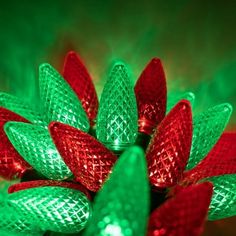 green and red christmas lights are arranged in the shape of a flower