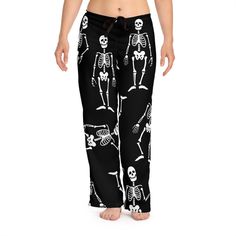 Perfect addition to any Halloween lover's collection! The cute skeleton PJ pants with super cute dancing skeletons will become an instant Fall favorite! Add style to any loungewear collection with these skeleton print pajama pants. They are 100% polyester jersey knit fabric, along with the relaxed fit, makes for the ultimate comfort choice while kicking back at home. Meanwhile, the back elastic with the drawstring tie creates the perfect fit while the all-over-print adds a stylish dimension uniq Goth Pajama Pants, Skeleton Pajama Pants, Horror Pajama Pants, Skull Pants Pajamas, Skull Pyjama Pants, Cute Skeleton, Halloween Pajamas, Womens Pajamas Pants, Pj Pants