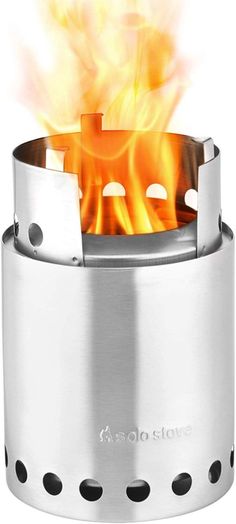 a stove that is on fire with flames coming out of the top and bottom part