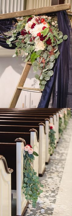 the floral arrangement is on top of the pews