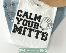 a t - shirt that says calm your mitts with a baseball glove on it