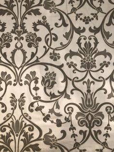 an ornate wallpaper with black and white designs