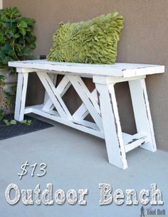 an outdoor bench made out of wood with a green pillow on it and text overlay that reads, 13 outdoor bench