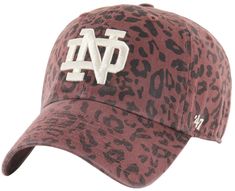 a maroon and white hat with the letter n on it's front, in leopard print