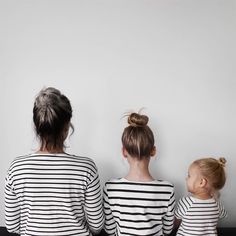 two women and a child sitting on the floor