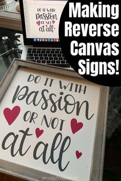 a laptop computer sitting on top of a desk next to a sign that says making reverse canvass signs