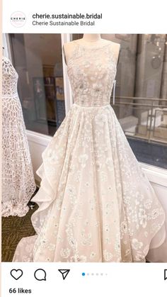 a dress on display in front of a window with the words, cherie australia bridal