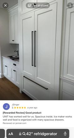 an image of a kitchen with white cabinets and appliances on the bottom right hand corner