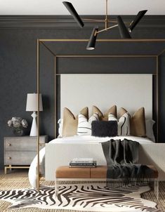 the bedroom is decorated in black, white and gold colors with zebra print rugs