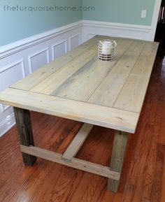 a wooden table sitting on top of a hard wood floor