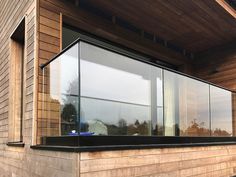 an outside view of a wooden building with windows