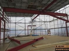 the inside of a building under construction with scaffolding on it's sides