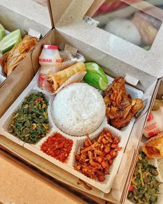 an open box filled with different types of food