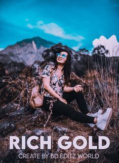 a woman sitting on top of a rocky hillside wearing sunglasses and a cowboy hat with the words rich gold