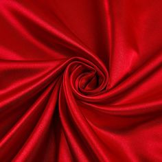 Red bridal satin fabric offers a beautiful smooth medium weight 100% polyester shiny satin material and popular for wedding dresses, gowns, apparel, fashion, and event decor. Bridal satin is an affordable option for table linens, draperies, chair covers, sashes, napkins, embroidered fabric, fashion, children's wear, crafts, and much more. Sold wholesale in a 70 yard roll. Color can vary by dye lot or batch. Catherine Medici, Satin Fabric Texture, Red Satin Fabric, Background Pics, For Wedding Dresses, Silk Satin Fabric, Satin Sheets, Beautiful Background, Drape Sleeves