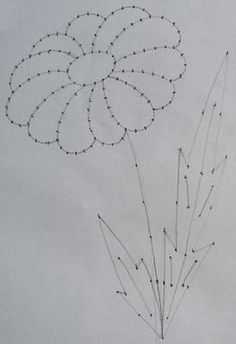 a drawing of a bunch of flowers on a white paper with lines drawn across it