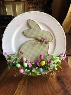 a white plate topped with an easter bunny decoration