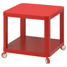 a small red table with wheels on the bottom and one shelf attached to each side