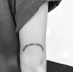 a person with a tattoo on their arm that says, waking the atmother