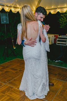 a man and woman dancing on a dance floor