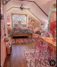 an attic bedroom decorated in pink and green